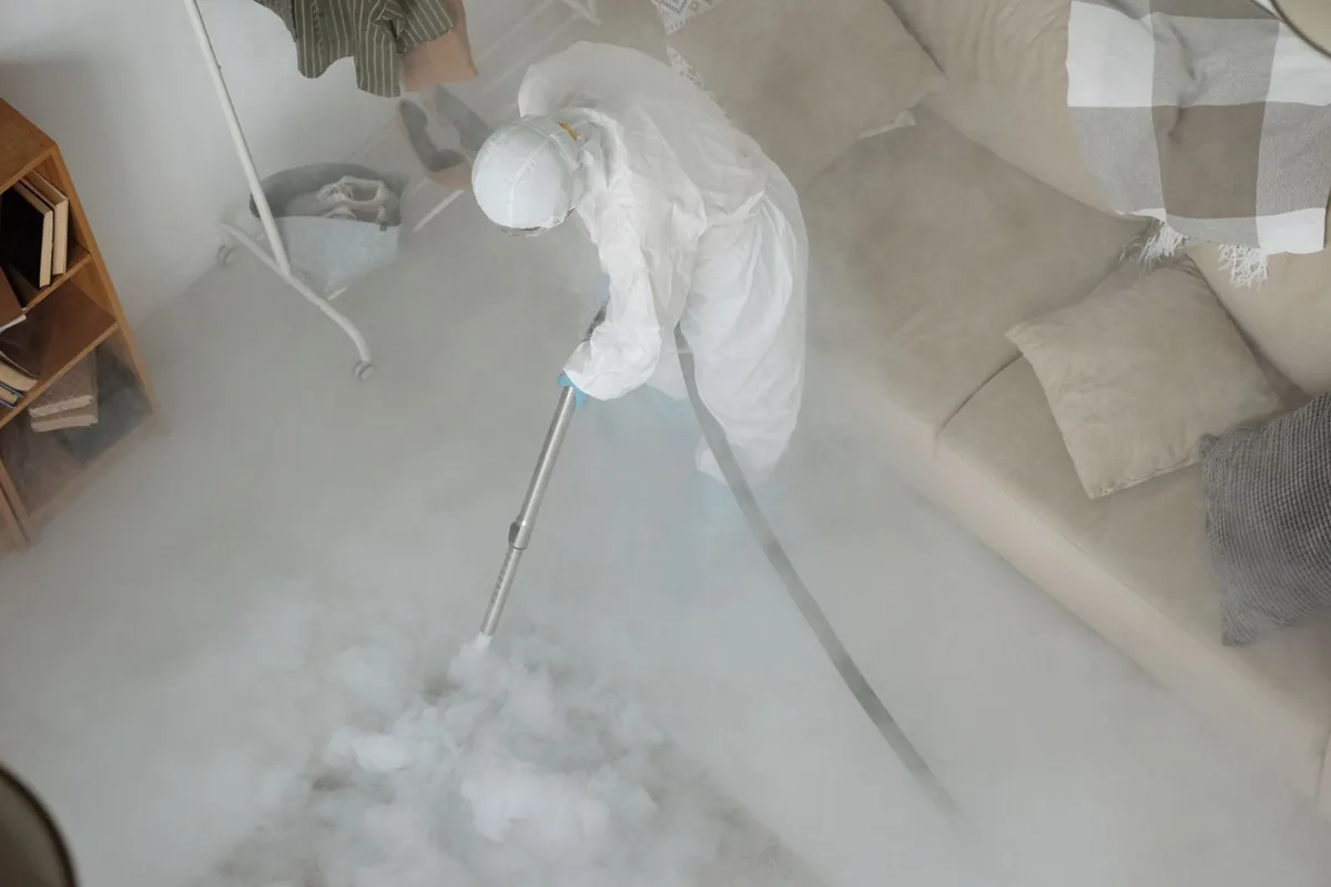 Biohazard cleanup technician in protective equipment, North Beacon Hill, Seattle, WA